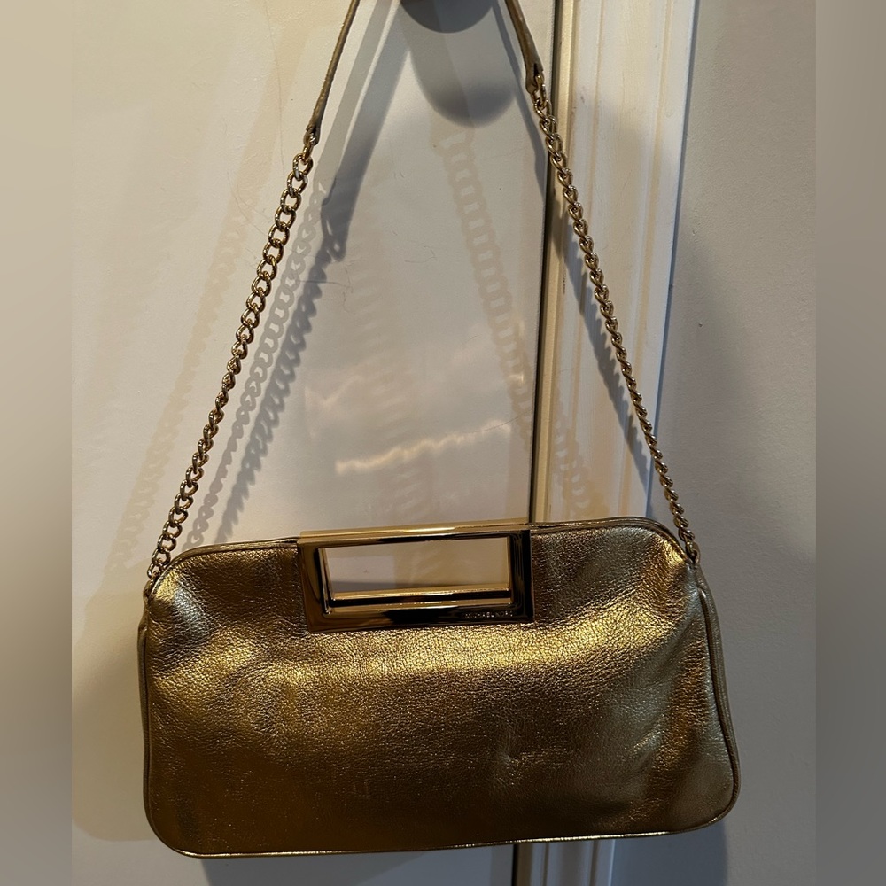 Gold Michael Kors clutch with long chain strap